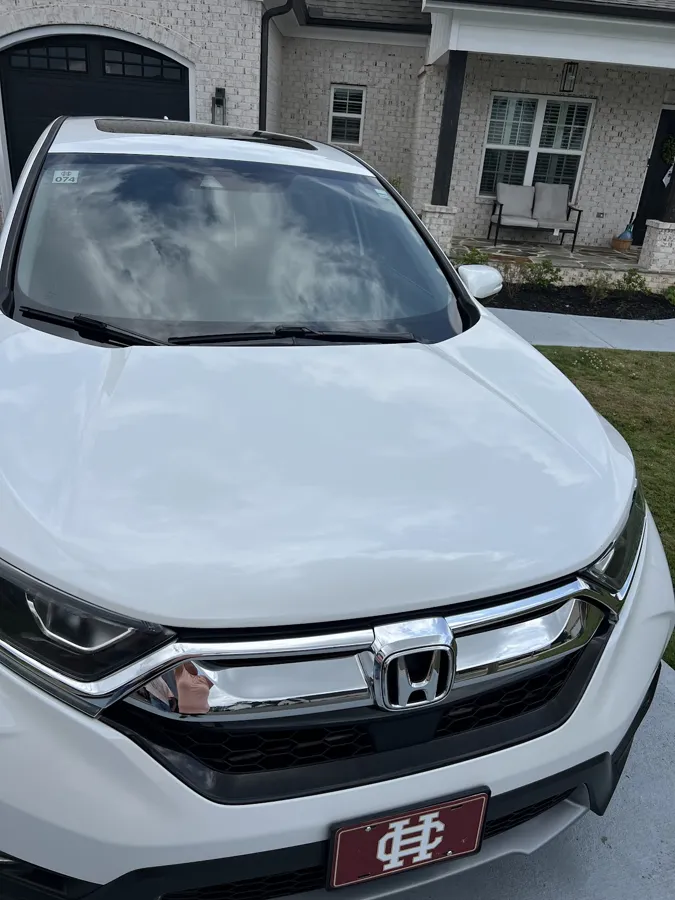 Front end and glass cleaned on a white Honda at the customer's home